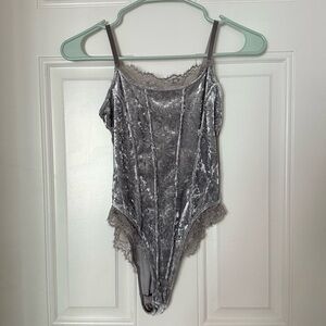Lacy and velvety body suit